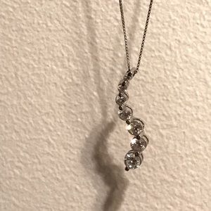 White gold 7 diamond necklace.